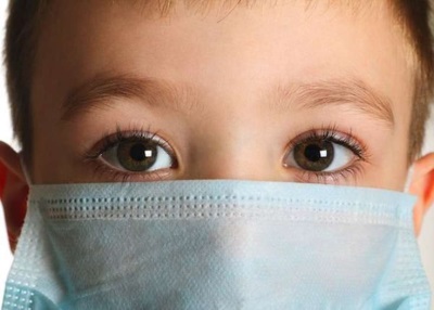 The child in the mask with the disease
