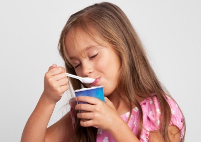 Girl eating yogurt
